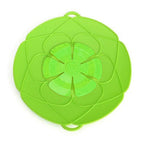 The Silicone Spill Stopper Lid showcasing its universal fit on a pan.