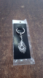 Stainless steel keychain with intricate peacock feather motif