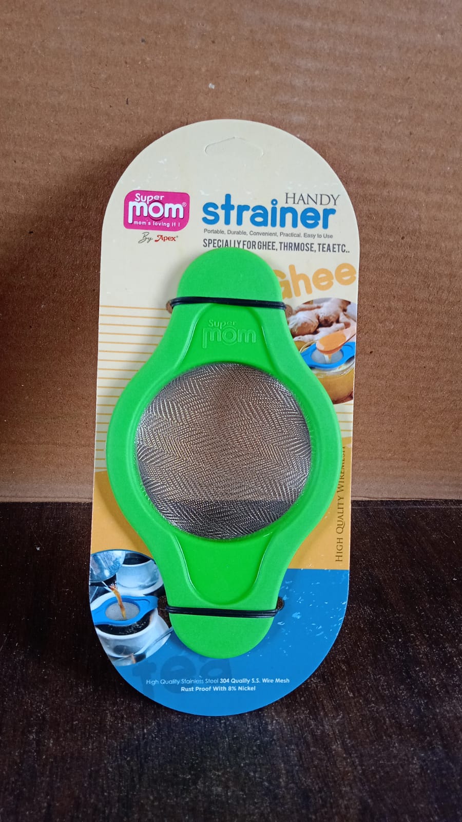 Full angled view of stainless steel mesh strainer with dual handles