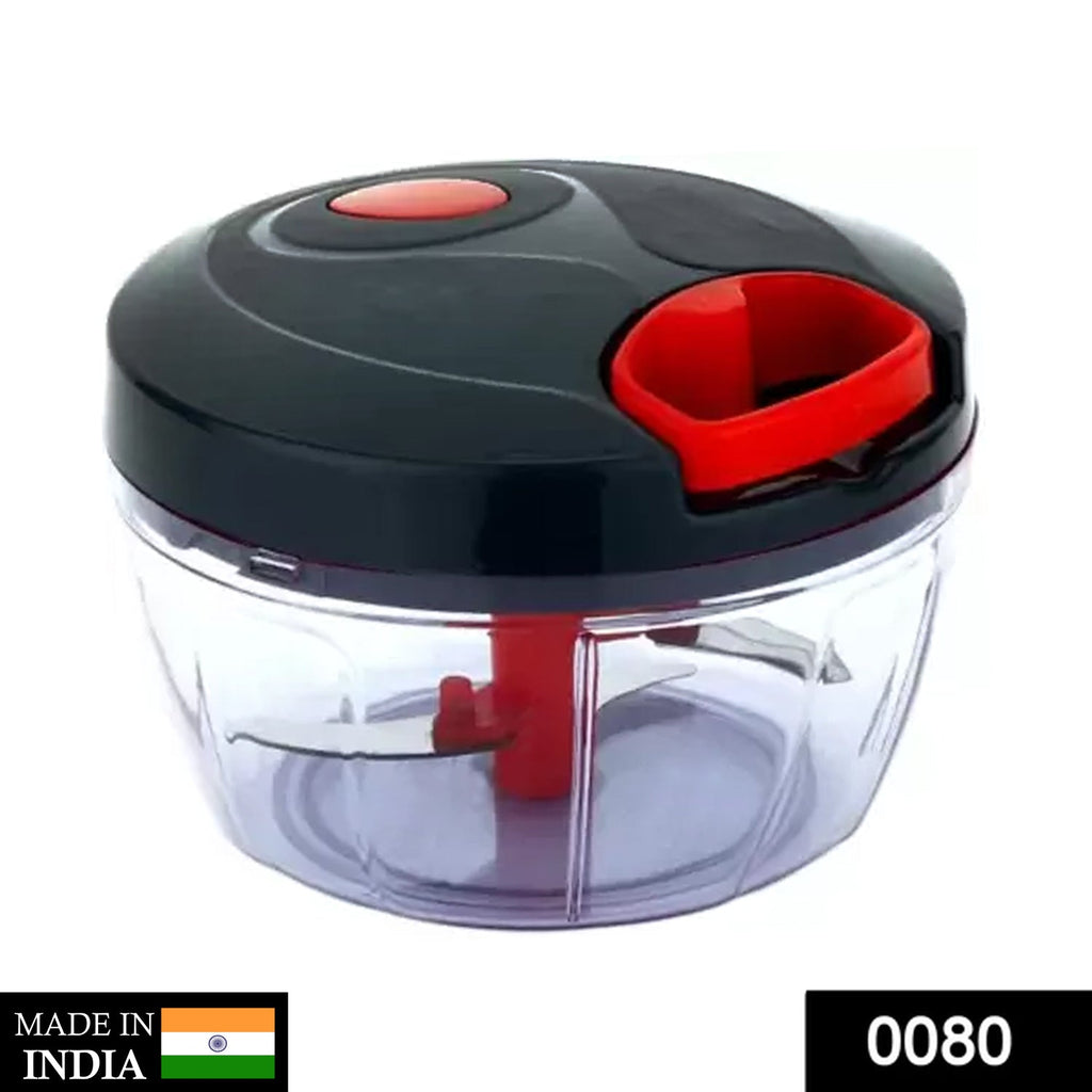 Compact manual food chopper demonstrating its pull-cord mechanism for chopping vegetables.