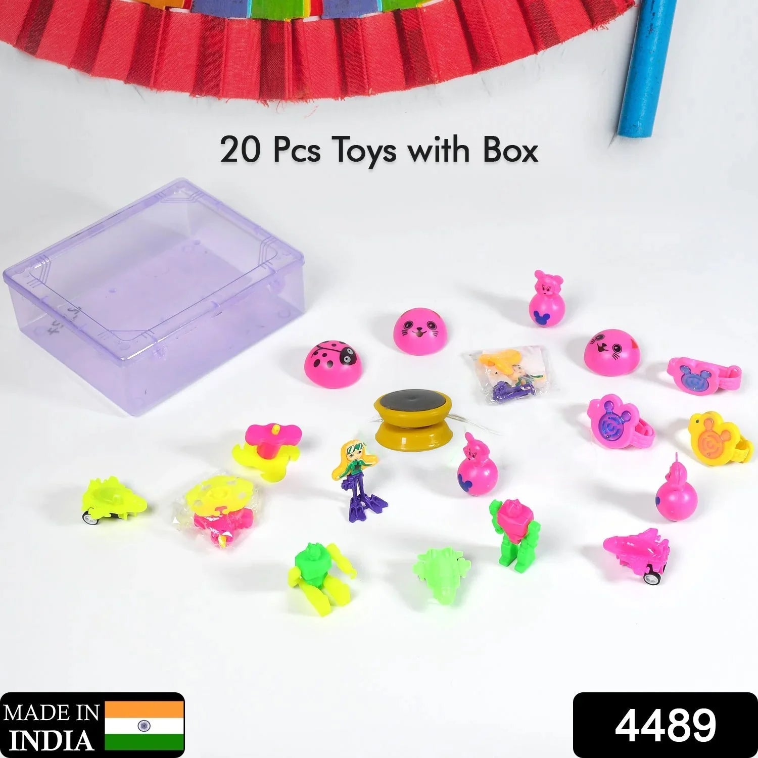 Close-up of assorted colorful toys inside the transparent plastic storage container.