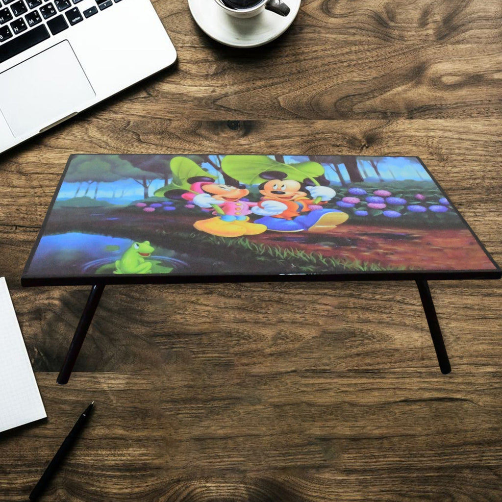 A vibrant cartoon-printed kids study table with foldable legs, perfect for learning and play.