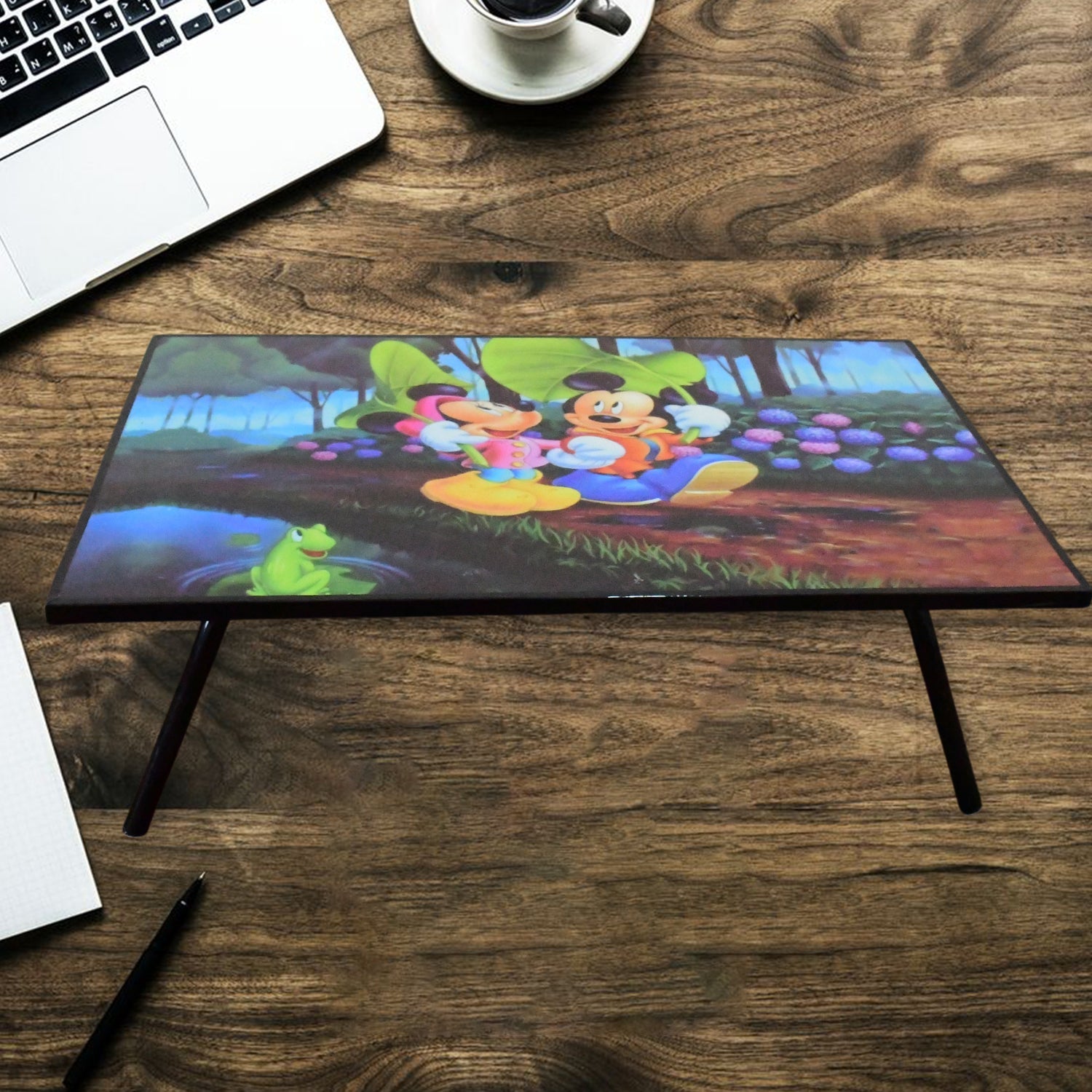 A vibrant cartoon-printed kids study table with foldable legs, perfect for learning and play.