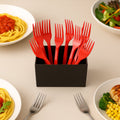 Pack of 8 red disposable plastic forks neatly arranged