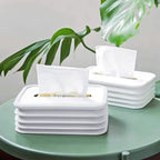 Modern silicone tissue holder with wave design on an office desk.