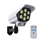 Motion-activated solar security camera light illuminating a dark outdoor area.