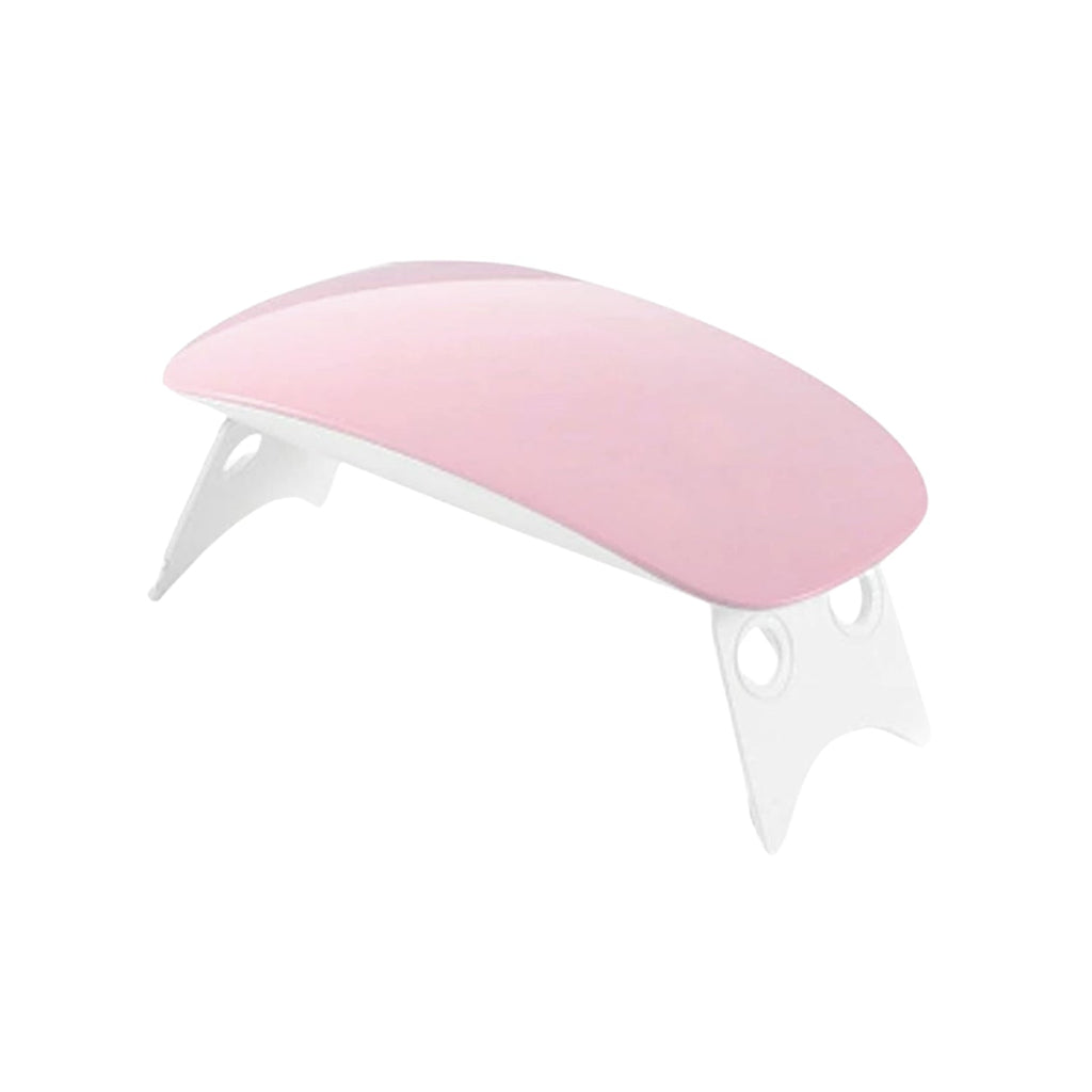 Hand curing gel nails under the portable Gel Nail Dryer.
