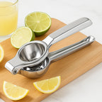 Close-up of the robust stainless steel lemon squeezer with its ergonomic handles.
