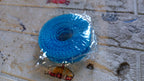 Organivo branded anti-slip clothesline rope set up indoors for laundry drying.