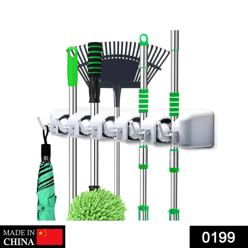 Close-up of the multi-purpose wall organizer securing a mop and broom.