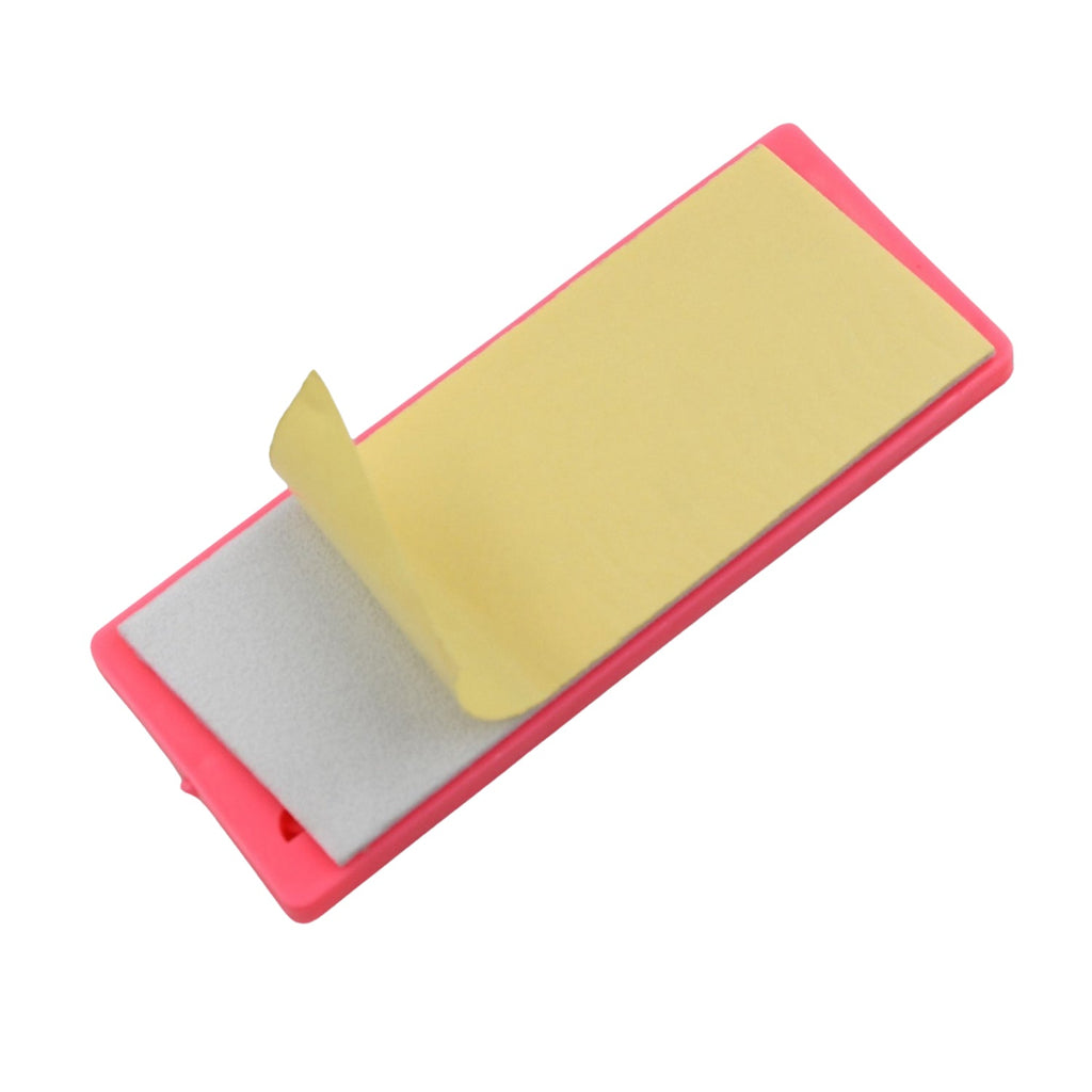 A wall-mounted Self Adhesive Plug Organizer neatly holding multiple device cables and chargers.