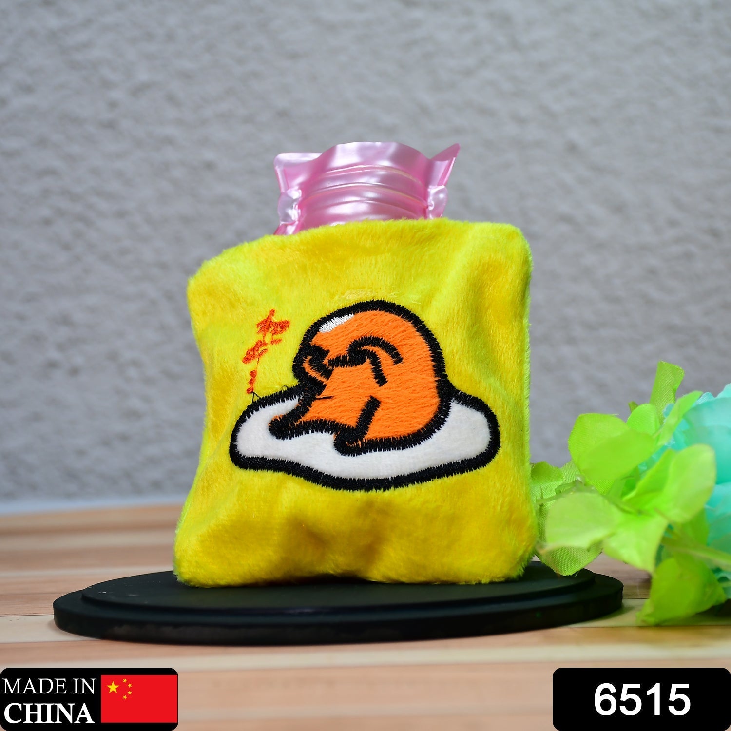 Close-up of the yellow duck head hot water bag, showcasing its adorable design.