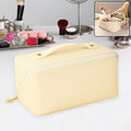 Cream-colored waterproof travel makeup organizer pouch with zipper and carry handle