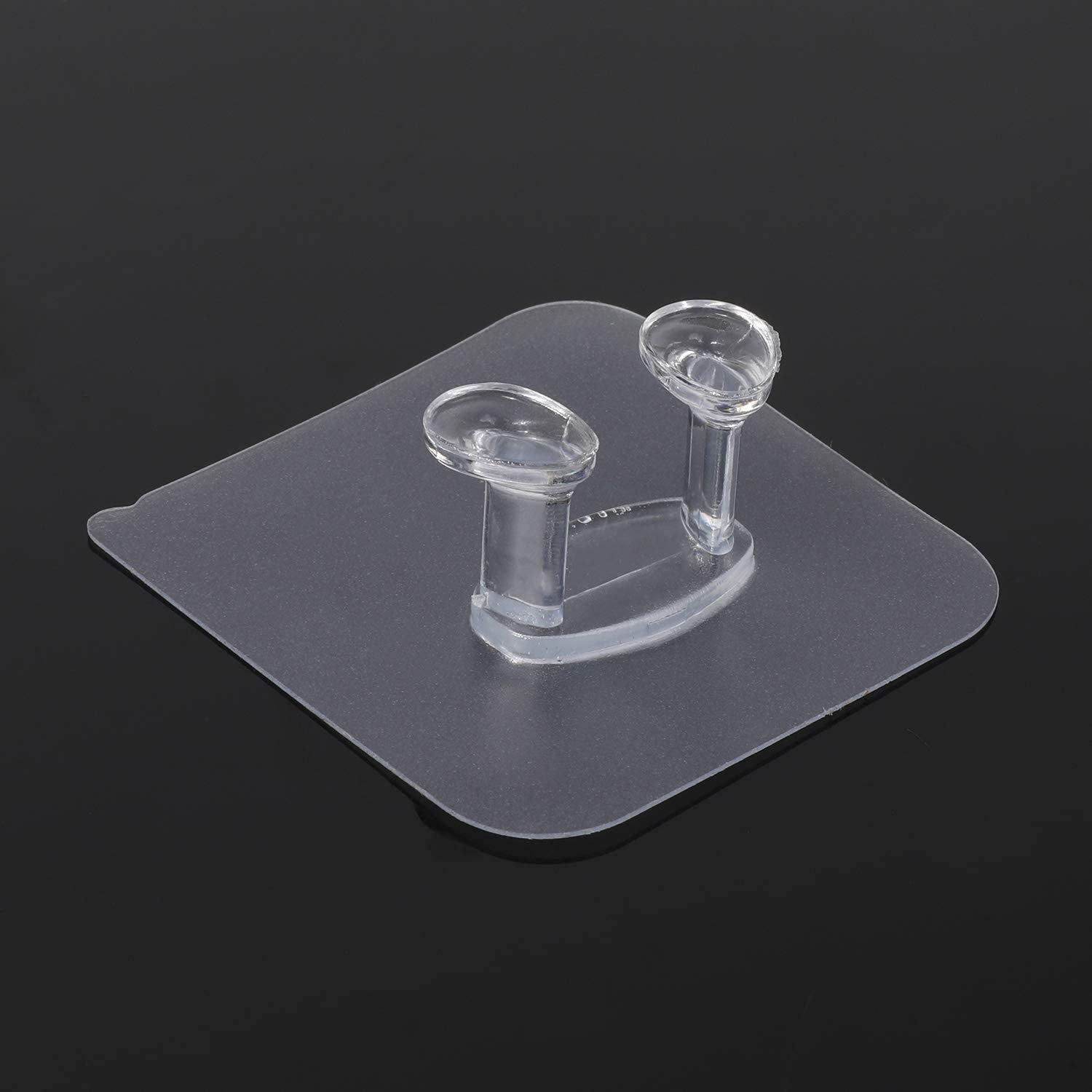Modern interior featuring a transparent self-adhesive wall hook on a light wall.
