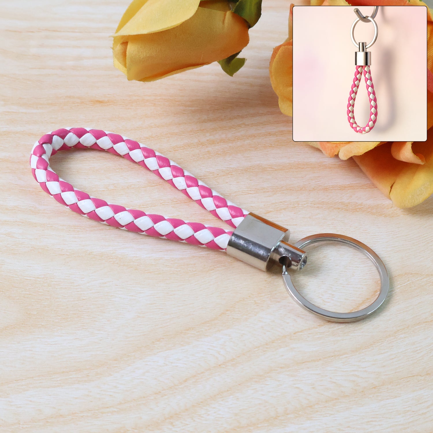Braided leather keychain featuring durable metal ring and two-tone braid design