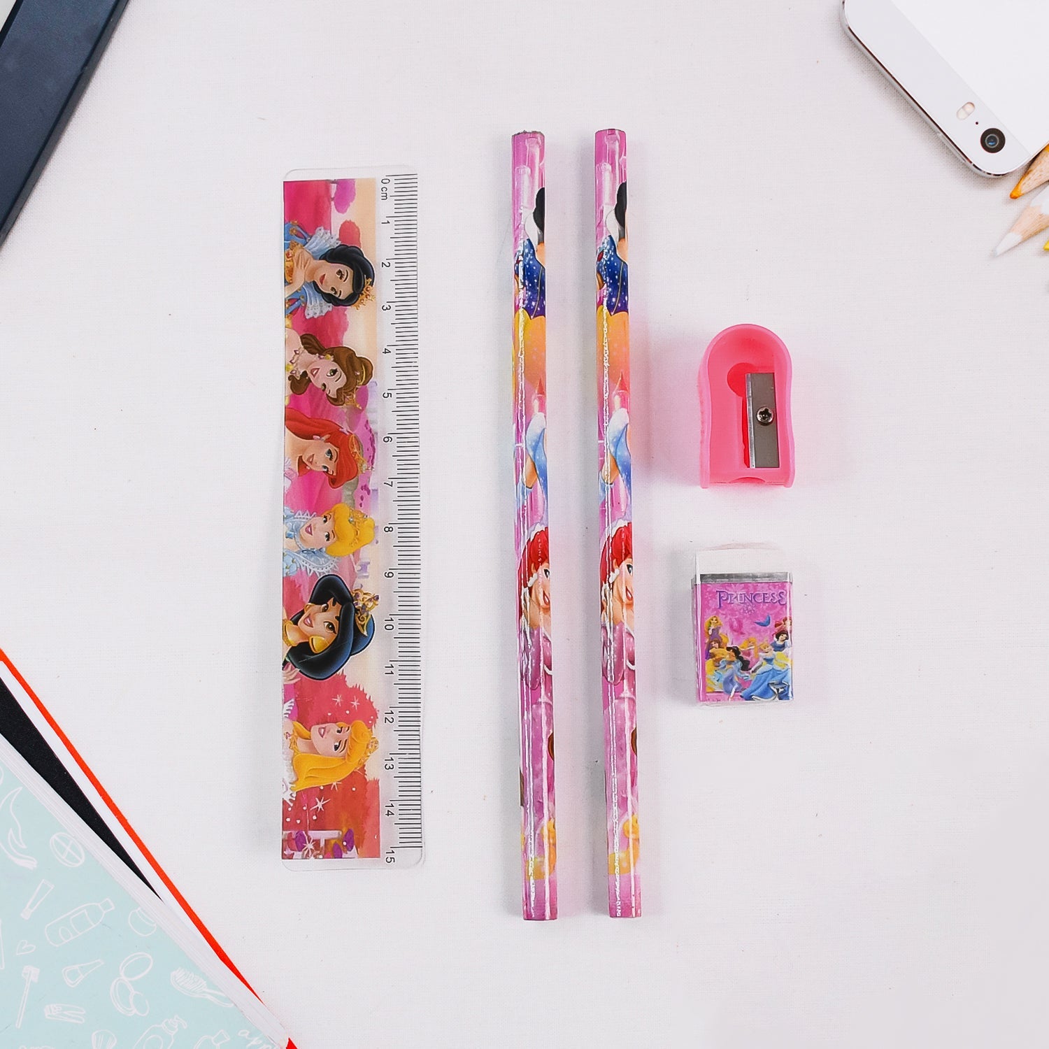 Close-up of the Cartoon Wooden Pencil Set showing a pencil, ruler, sharpener, and eraser.