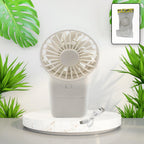 White portable handheld fan with a sleek design, ready for personal cooling.