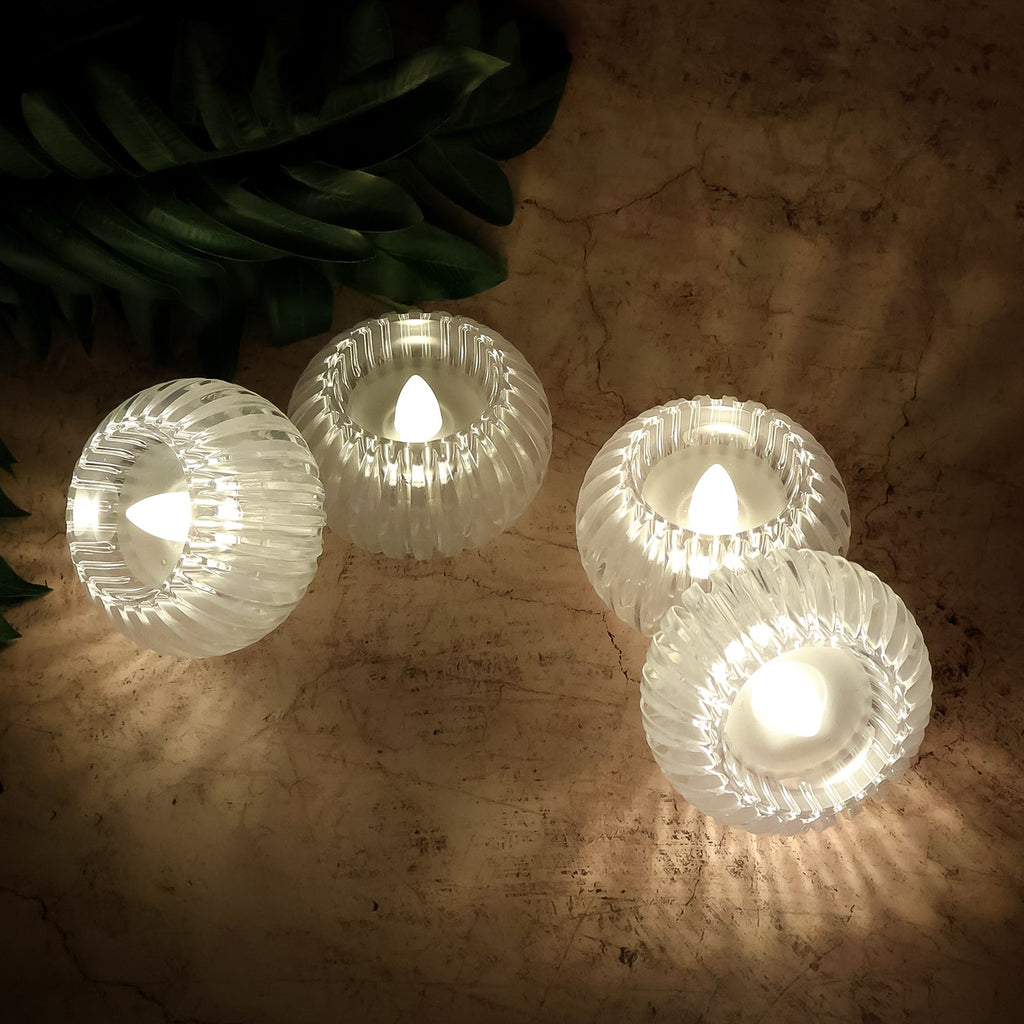 Set of 4 LED flameless decorative candles in elegant crystal-style holders providing safe indoor lighting