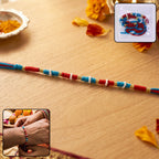 Elegant pearl beaded rakhi with golden accents for Raksha Bandhan