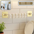 Kitchen utility hook rack with multiple hooks and stainless steel rod mounted on wall
