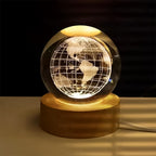 3D crystal ball lamp with world map projection on a wooden base.