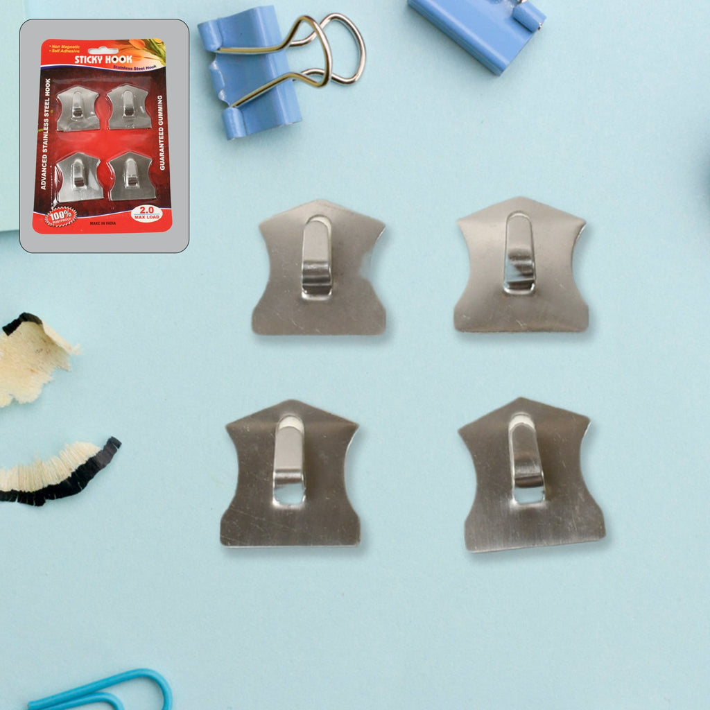 Heavy-duty self-adhesive hooks securely holding a robe, coat, and towel in a modern bathroom.