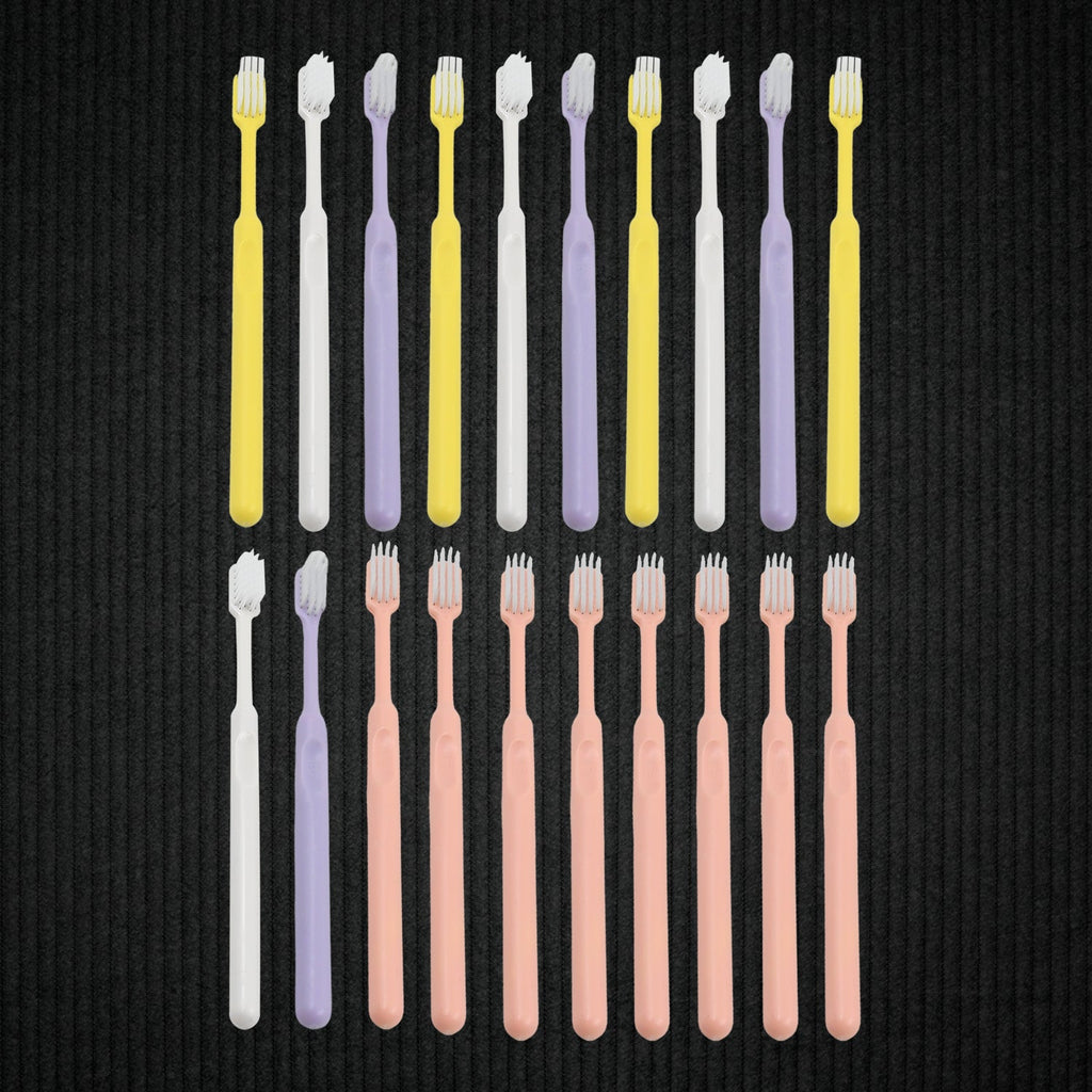 Detailed view of the ultra-soft bristles on a plastic toothbrush, designed for gentle yet effective cleaning.