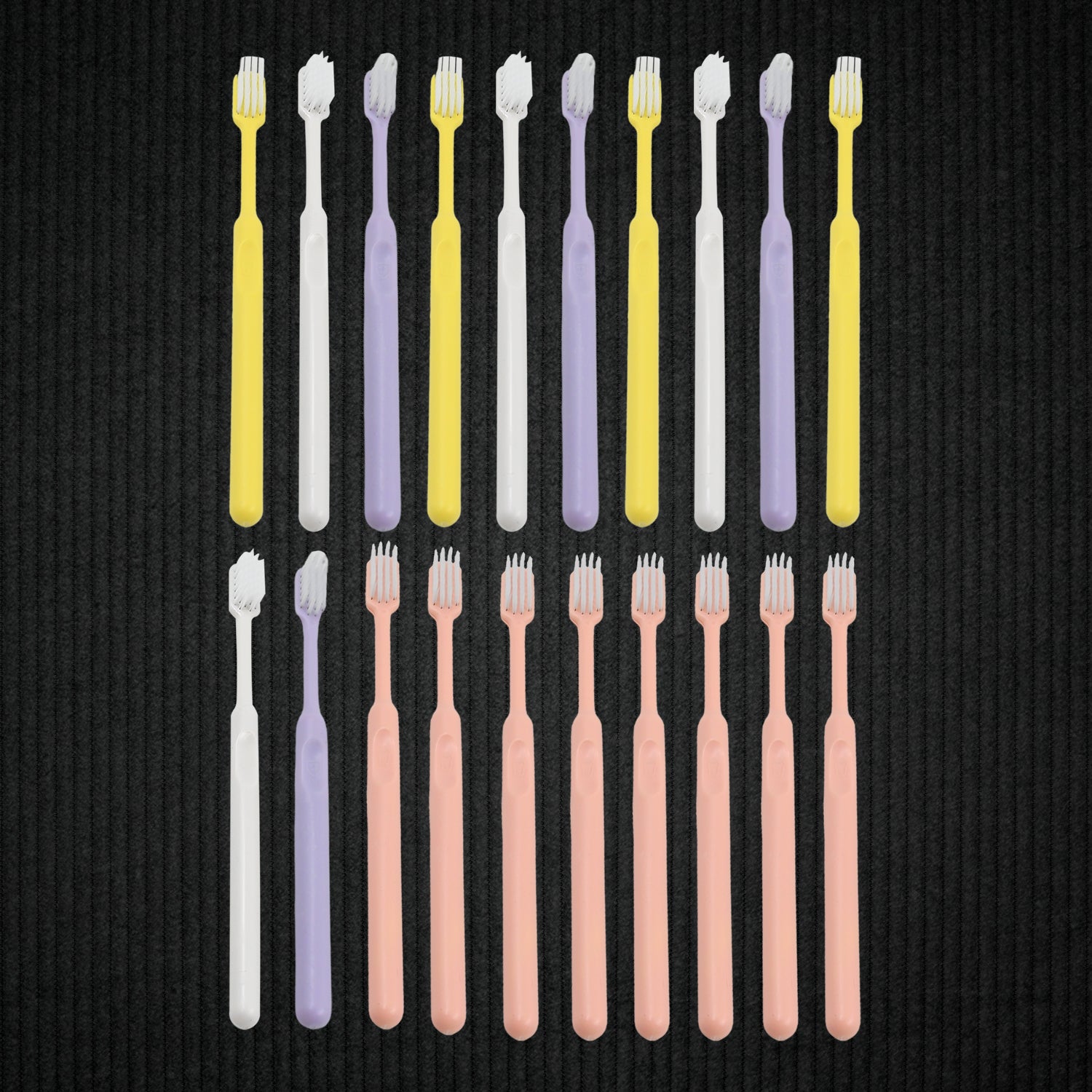 Detailed view of the ultra-soft bristles on a plastic toothbrush, designed for gentle yet effective cleaning.