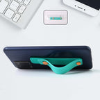 Teal Green phone loop finger holder secured on smartphone