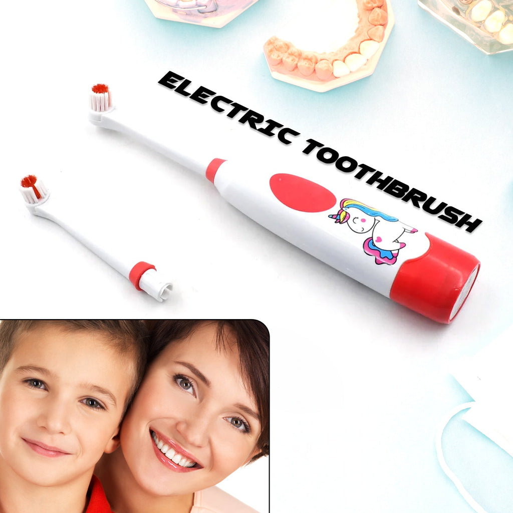 White electric toothbrush kit including two batteries and a spare brush head.