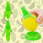 Close-up of the stainless steel fruit sprayer inserted into a lemon.