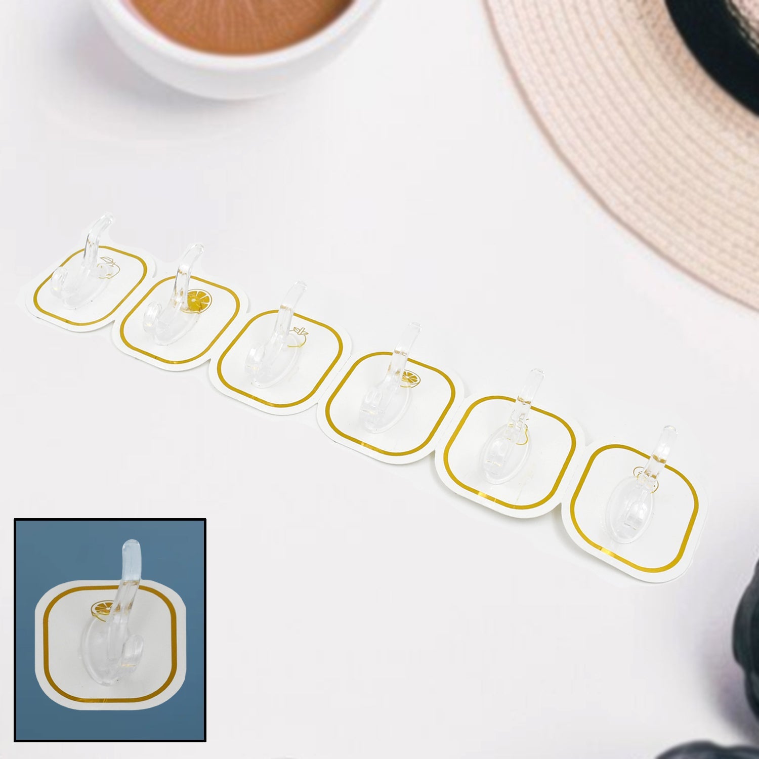 Set of six transparent adhesive hooks displayed neatly, ready for home organization.