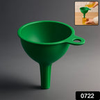 Food-grade silicone funnel smoothly pouring cooking oil into a glass bottle, preventing spills.