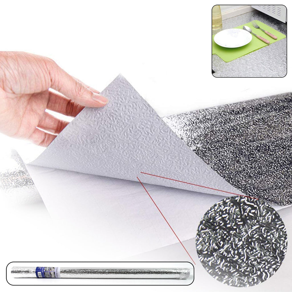 Roll of self-adhesive aluminium kitchen foil for surface protection.