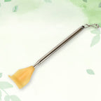 Close-up of the anti-slip rubber handle on the back scratcher, ensuring a secure grip.
