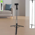 Adjustable selfie stick with tripod stand and Bluetooth remote in use