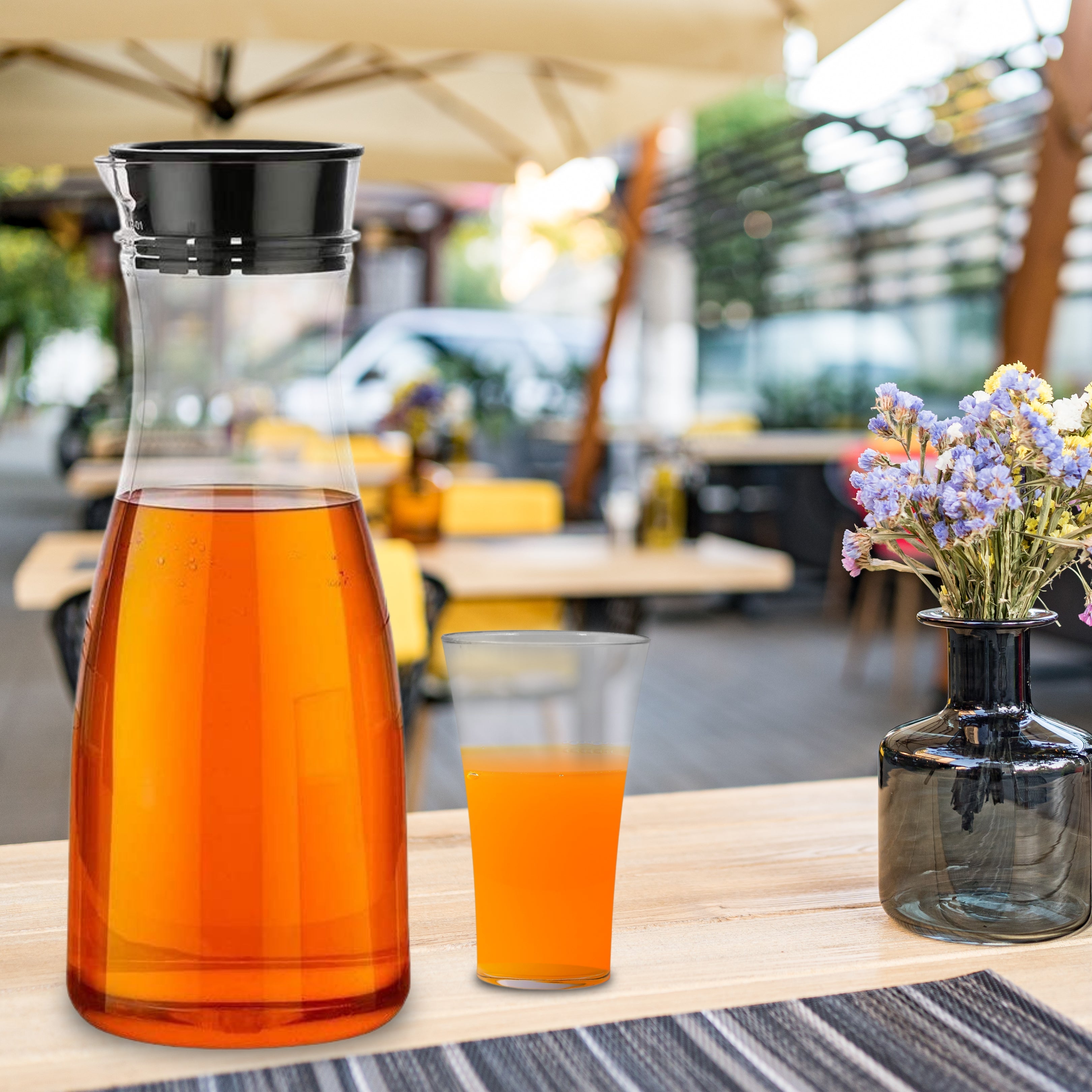 Durable unbreakable jug and glass combo set on a dining table.