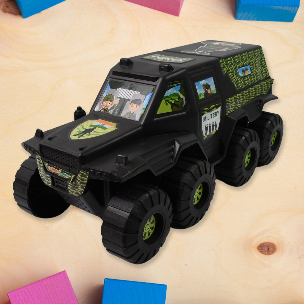 Military toy car in action on a play surface, showcasing its wheels.