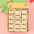 Thirty bright yellow 4B erasers neatly packaged for students and office use.