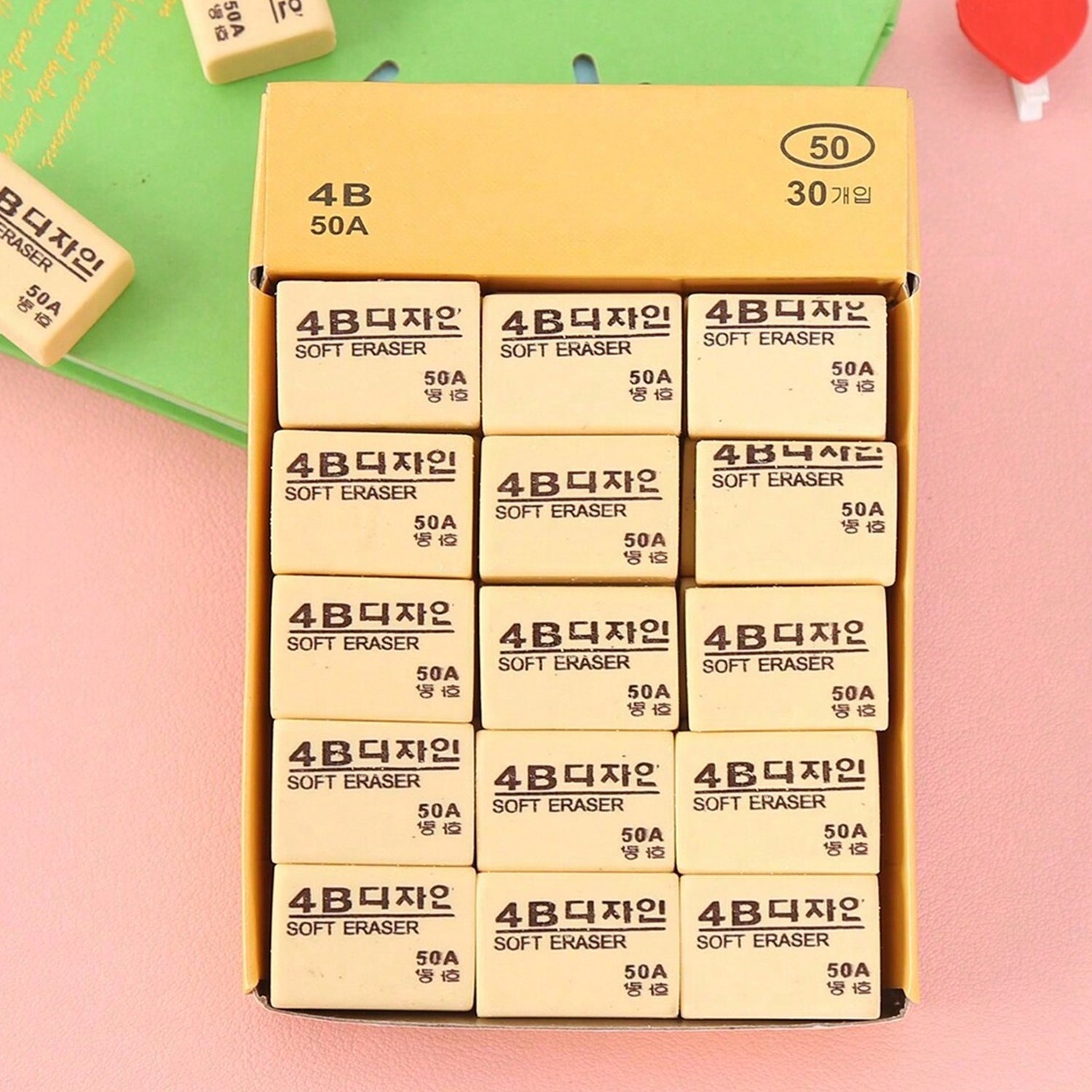 Thirty bright yellow 4B erasers neatly packaged for students and office use.