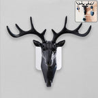 Elegant deer head wall hook in black, showcasing its self-adhesive design.