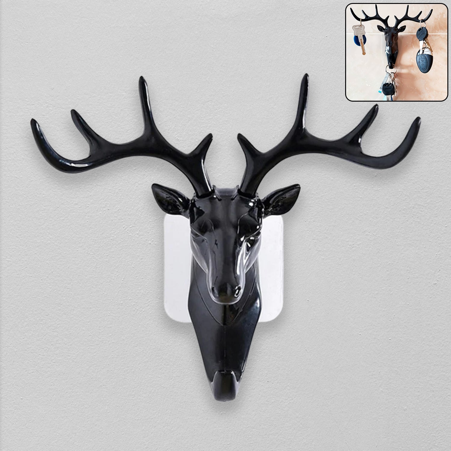 Elegant deer head wall hook in black, showcasing its self-adhesive design.