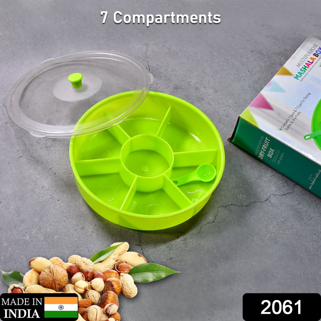 Top-down view of a 7-compartment Dry Fruit & Masala Box with its included spoon.