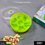 Top-down view of a 7-compartment Dry Fruit & Masala Box with its included spoon.