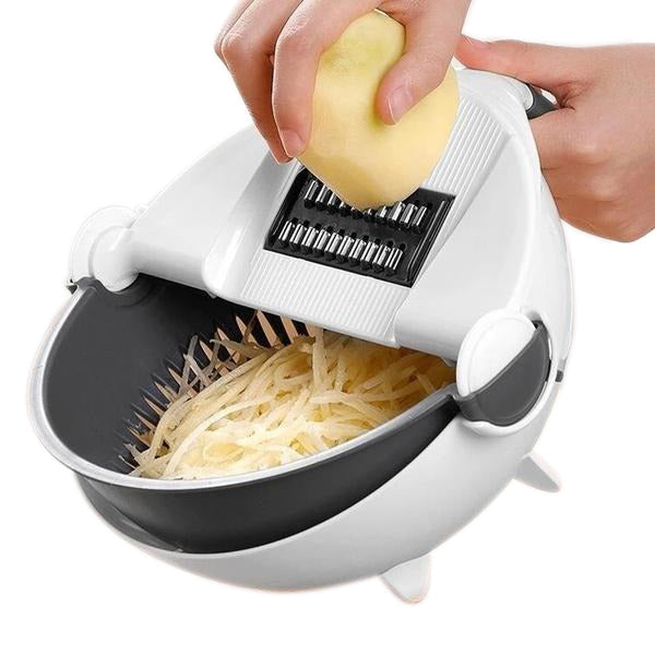 The versatile vegetable cutter with its rotating drain basket and interchangeable slicing blades ready for use.