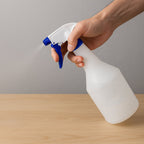 Side view of ergonomic plastic trigger spray bottle with comfort grip