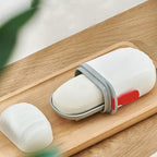 VelvetBubbles leakproof travel soap case in blue, securely holding a bar of soap.