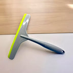 Grey kitchen wiper with silicone head for streak-free cleaning.
