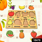 Toddler hands playing with the wooden fruit puzzle, placing a banana shape.