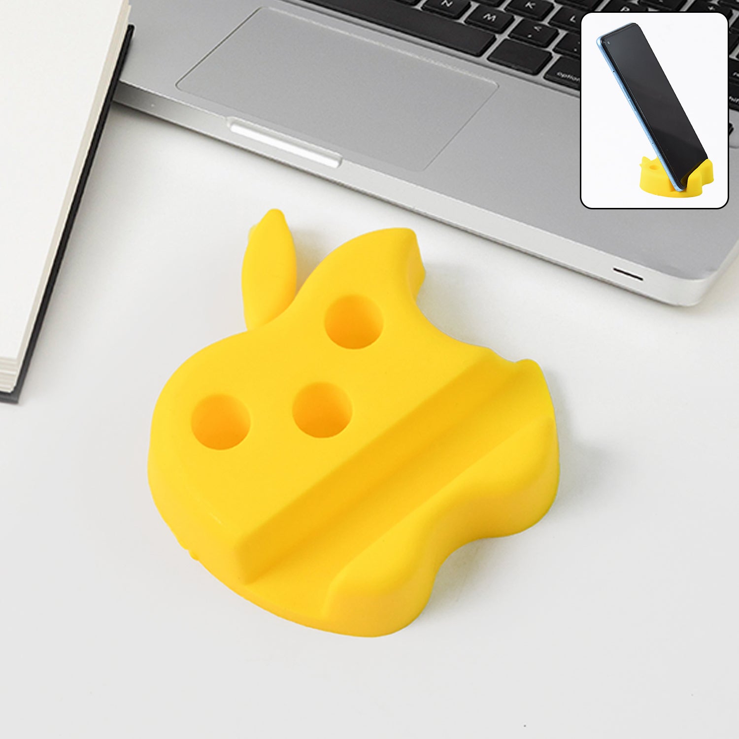 Apple-shaped plastic mobile stand with pen holder on desk supporting a smartphone